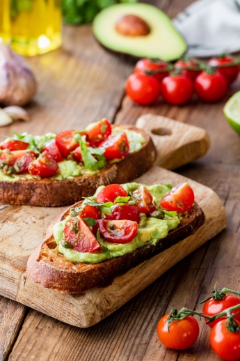 Warm toast wth avocado and cherry tomatoes