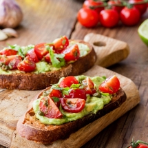 Warm toast wth avocado and cherry tomatoes